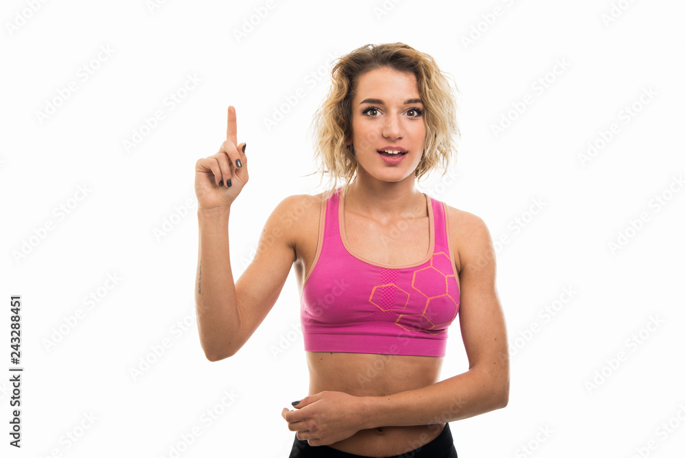 Portrait of beautiful young fit girl making idea gesture Portrait of beautiful young fit girl making idea gesture