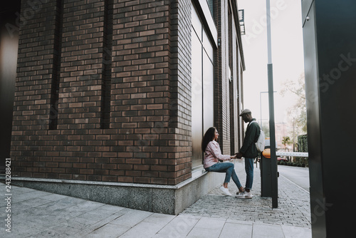 Beautiful male and female couple holding hands