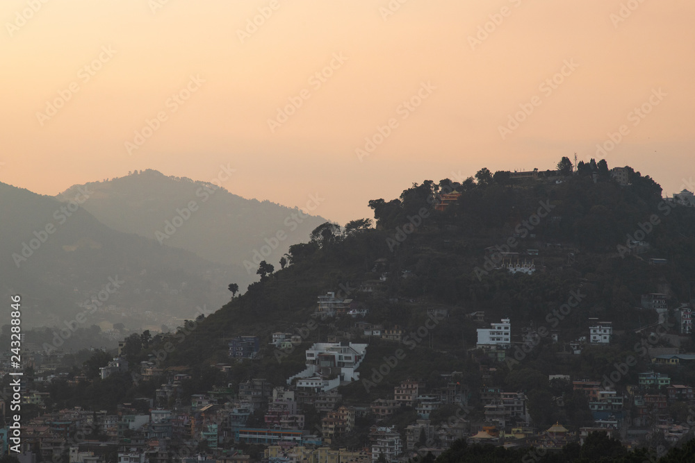 Sunset view of building and mountains during sunset at Kathmandu, Nepal.