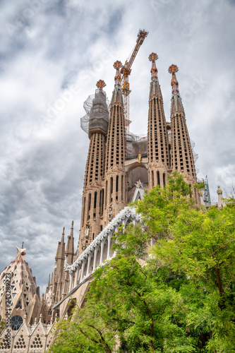 BARCELONA, SPAIN - MAY 14, 2018: Cathedral of La Sagrada Familia on a cloudy day. It is designed by architect Antonio Gaudi and is being build since 1882