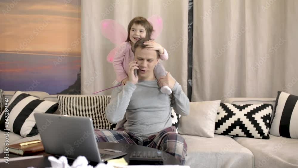Daughter helping father working at home Daughter helping father working at home