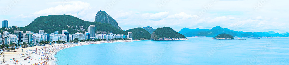 Fototapeta premium Copacabana Beach and Sugar Loaf Mountain in Rio de Janeiro, Brazil. Aerial view of Rio de Janeiro with Copacabana. horizontal