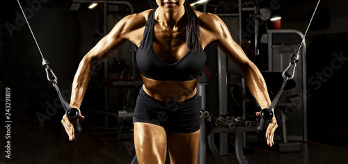 Fitness woman execute exercise with exercise-machine cable crossover © Andrey Burmakin