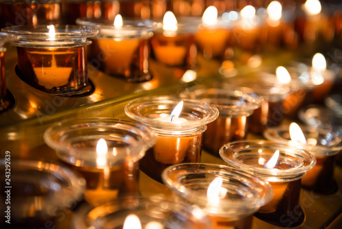 Candle light in the church as holiday christmas background