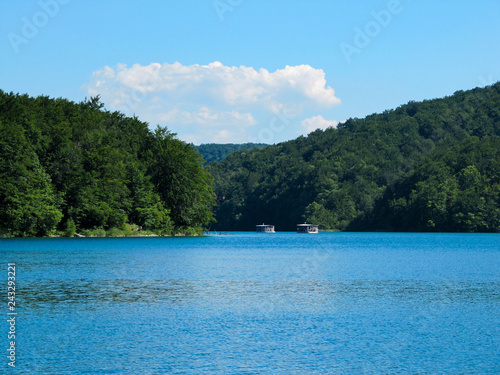 views of the two River boat floating on the lake in the national Park Plitvice lakes, Croatia. © Yulia