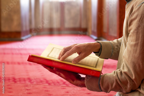 Muslim Man Reading Holy Book (Qur'an) Inside The Mosque