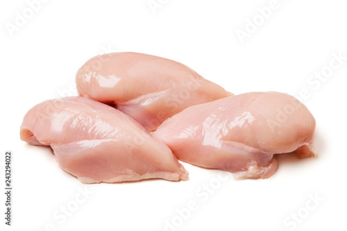 Raw chicken fillets close up on white