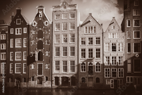 View at old city houses in Amsterdam, Netherlands. Image in sepia color style