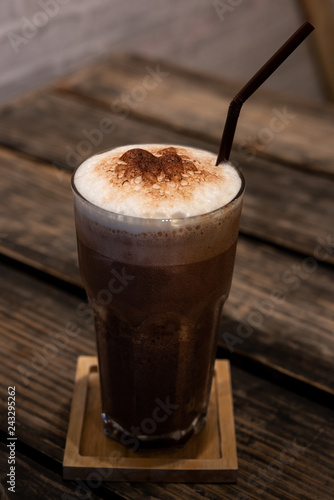 Chocolate smoothie, Cocoa drink, chocolate cocktail. On a wooden background.