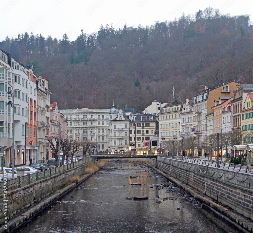 Naklejka premium people are walking by riverside in Karlovy Vary
