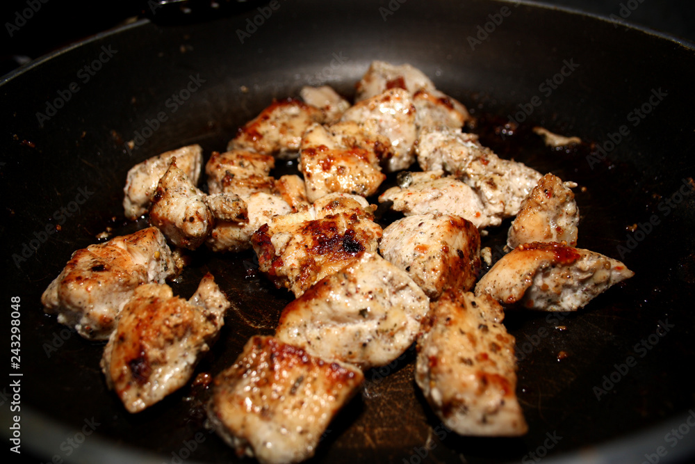 fried chicken in a black pan