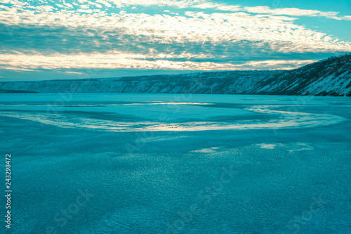 Blue ice of frozen lake landscape 