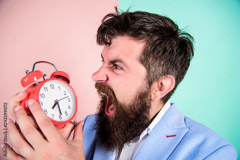 Time management skills. How much time till deadline. Time to work. Man bearded aggressive businessman hold clock. Stress concept. Hipster stressful working schedule. Businessman has lack of time - obrazy, fototapety, plakaty 