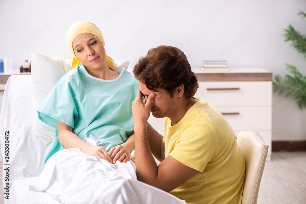 Husband looking after wife in hospital Husband looking after wife in hospital