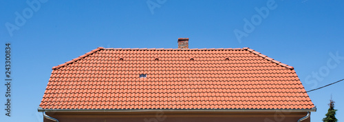 Tableau sur toile red roof of a house