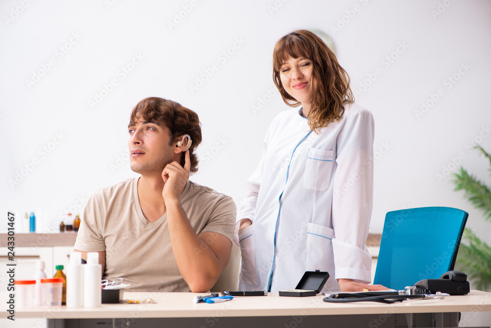 Fototapeta premium Patient with hearing problem visiting doctor otorhinolaryngologi
