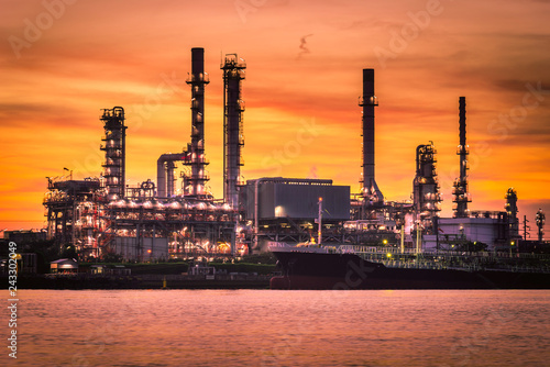Oil and gas Refinery factory with beautiful sky at sunrise.