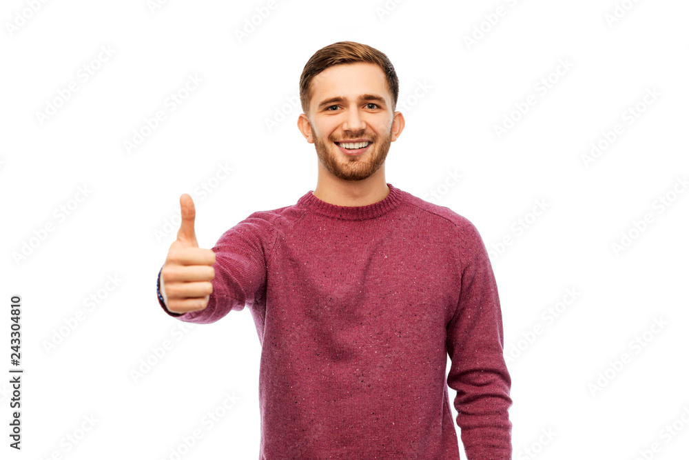gesture and people concept - happy young man showing thumbs up over white background gesture and people concept - happy young man showing thumbs up over white background