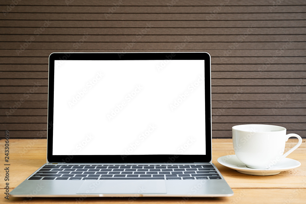 Coffee cup with laptop mockup on wood Coffee cup with laptop mockup on wood