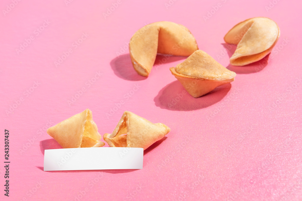 Broken fortune cookies with blank paper