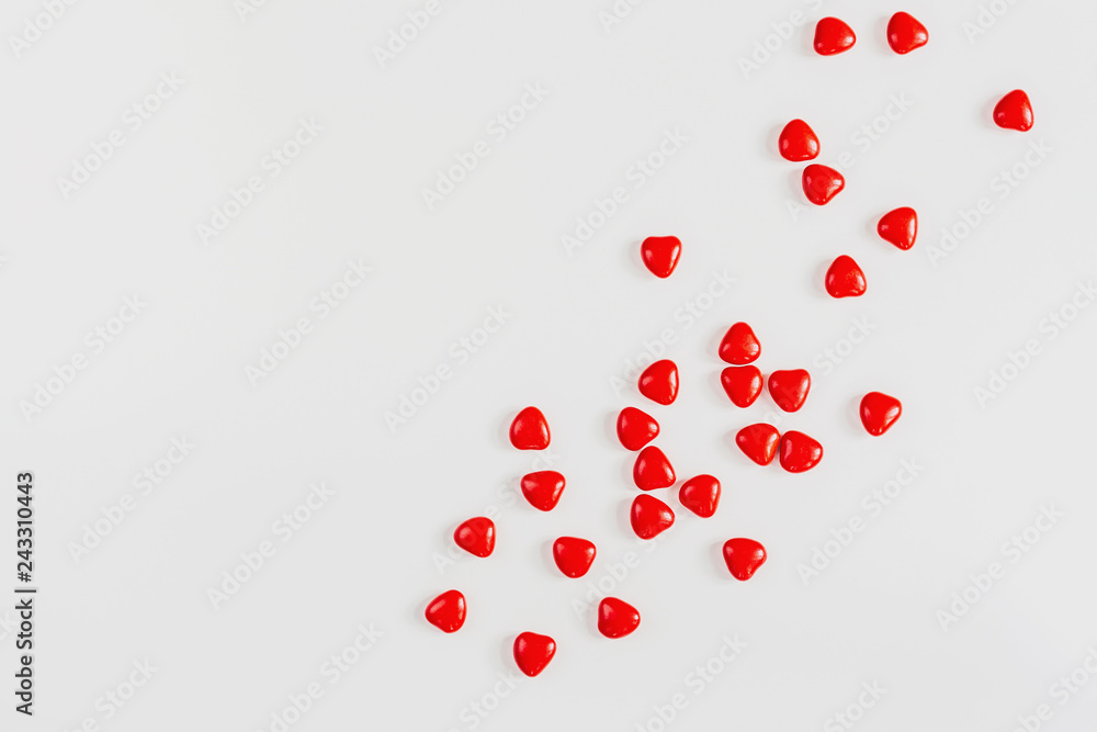 Valentines day background with red candy hearts, top view Valentines day background with red candy hearts, top view