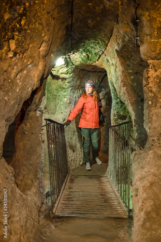 Young tourist woman explore ancient Kaymakli underground cave city