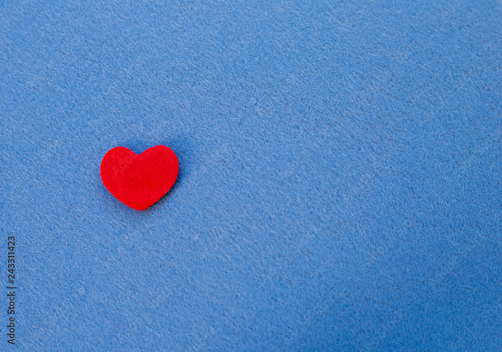Fototapeta premium Red heart on a blue background