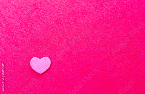 Pink heart on a red background