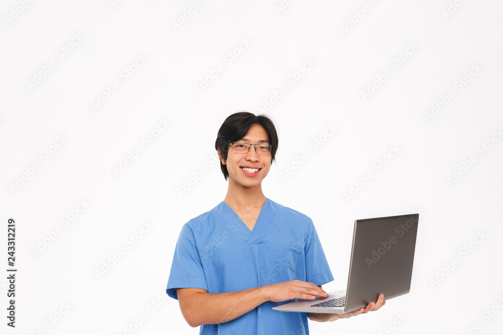 Smiling asian man doctor wearing uniform Smiling asian man doctor wearing uniform