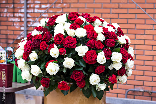A huge bouquet of white and red roses.