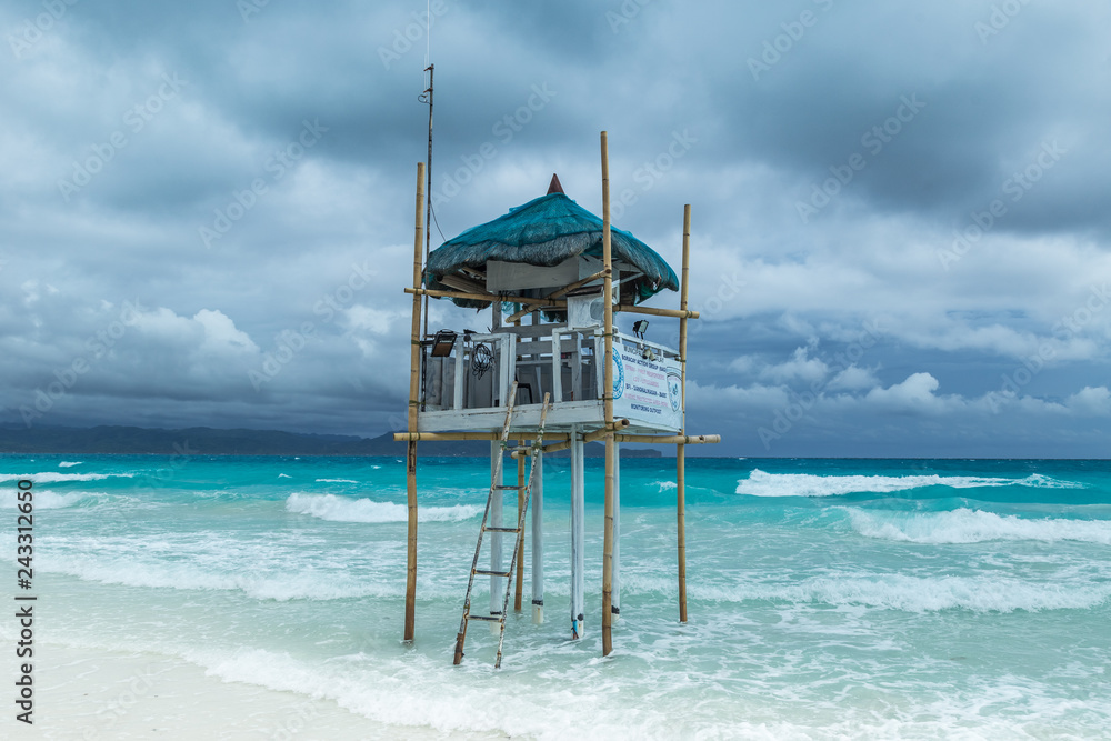 Beach guard rescue tower in Boracay at cloudy day, Philippines