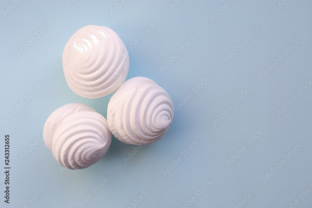 White marshmallows on blue background. Flat lay, copy space White marshmallows on blue background. Flat lay, copy space