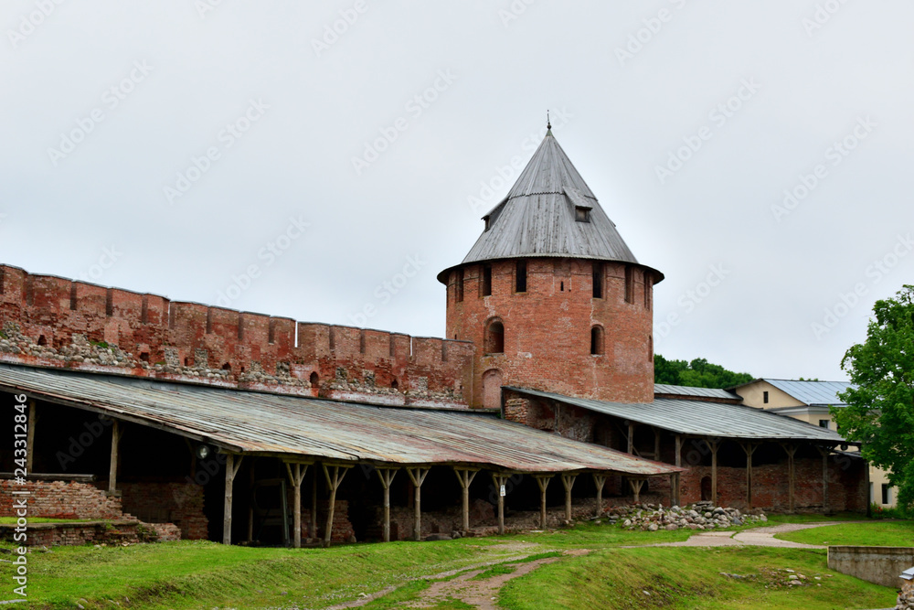Inside the ancient fortress in the city of Veliky Novgorod. The fortress wall of red brick. Novgorod Kremlin.