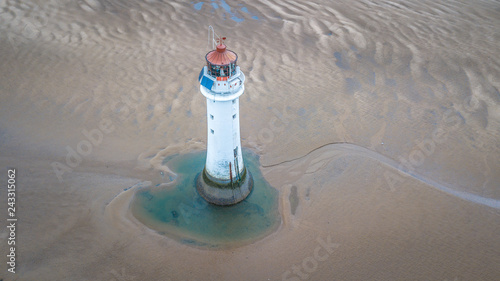 Overloonh the beach at Wallasey with New Brighton Lightouse in the foreground