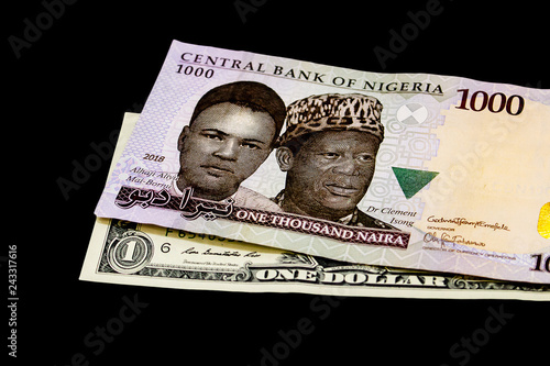 Nigerian naira note on a US Dollar bill - International trade - Globalization