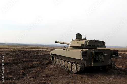 self-propelled artillery large caliber is in the field, rear view, Ukraine and Donbass conflict