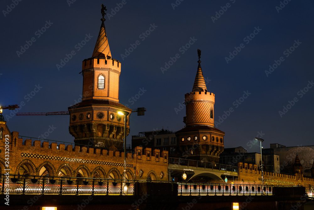 Bridge Oberbaum and Spree river in Berlin, Germany at night