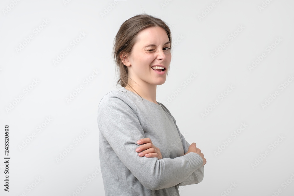 Cheerful young beautiful girl smiling winking looking at camera Cheerful young beautiful girl smiling winking looking at camera