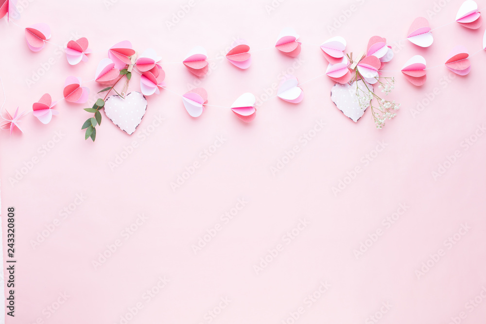 Colorful paper garland of hearts on the living coral background. Valentine day greeting cards. Colorful paper garland of hearts on the living coral background. Valentine day greeting cards.