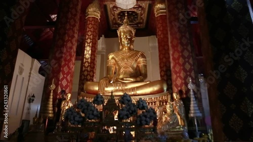 Push-in shot of Gold Buddha in Ayutthaya province, Thailand photo