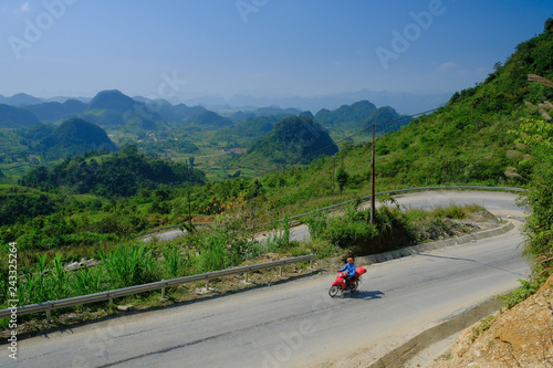 Ha Giang   Vietnam - 01 11 2017  Motorbiking backpackers on winding roads through valleys and karst mountain scenery in the North Vietnamese region of Ha Giang   Dong Van.