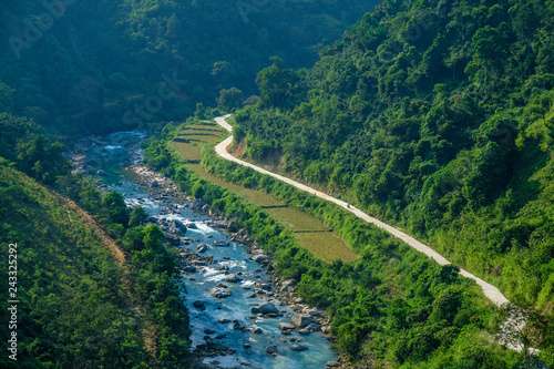 Winding roads through valleys and karst mountain scenery in the North Vietnamese region of Ha Giang / Dong Van.