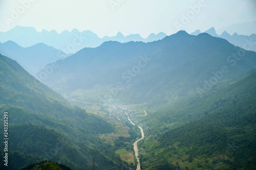 Winding roads through valleys and karst mountain scenery in the North Vietnamese region of Ha Giang / Dong Van.