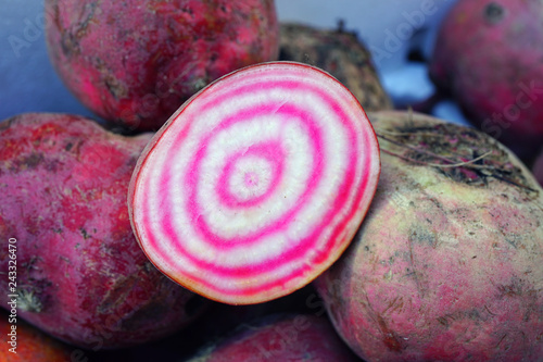 Fresh pink and white chioggia beets with concentric circles beets at a farmers market 