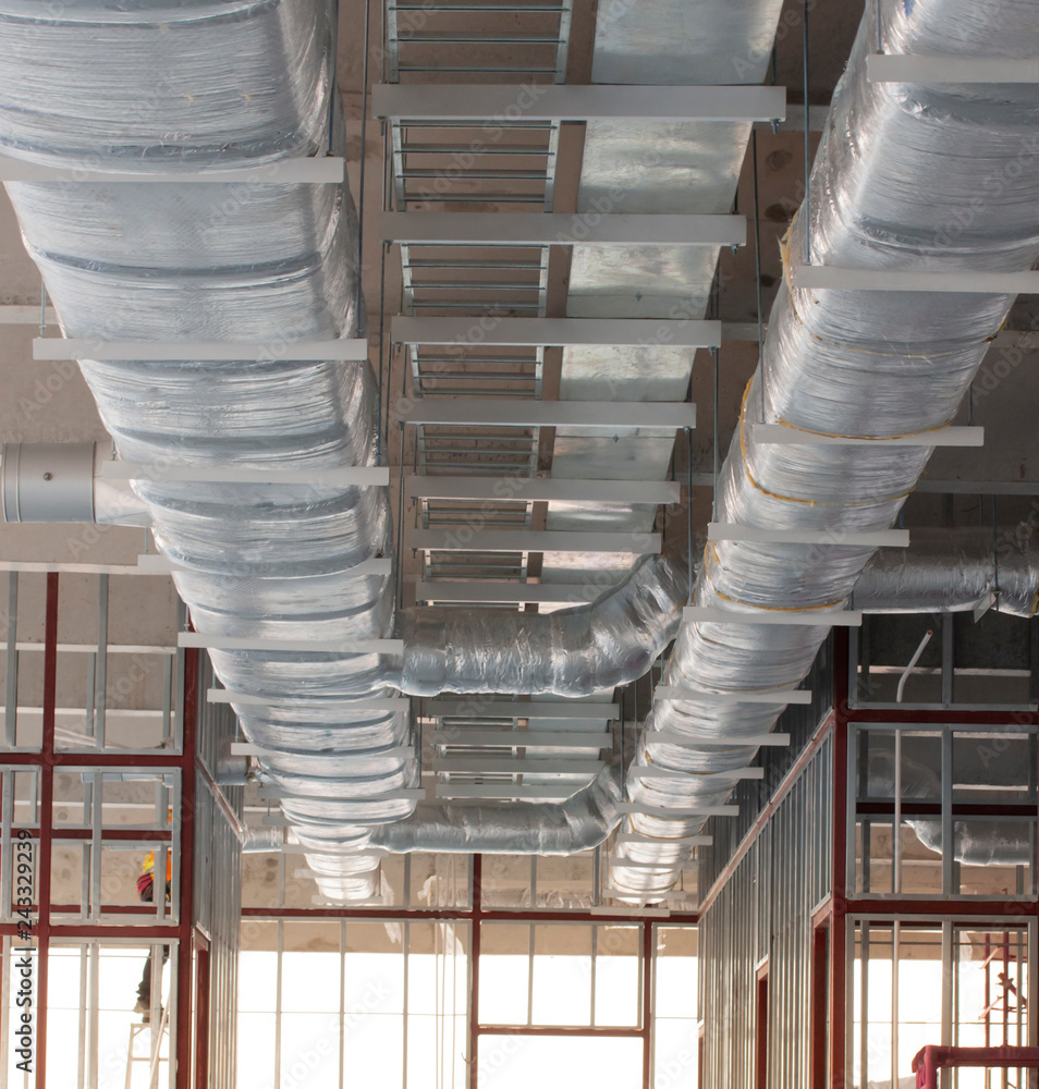 Typical installation of ducting with fiberglass insulation work combine