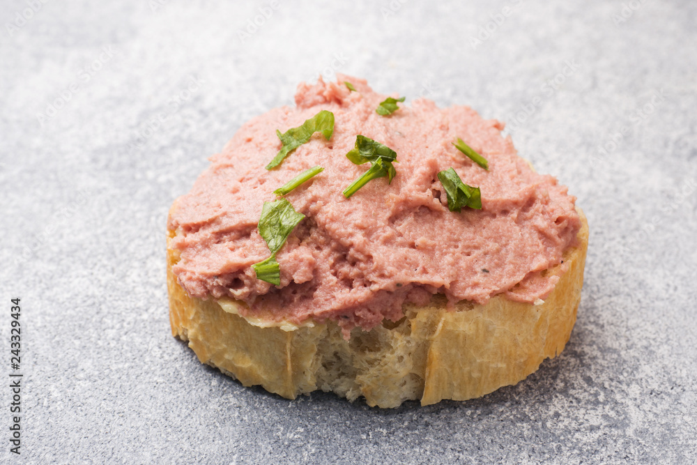 Sandwiches with chicken pate and butter on the table.