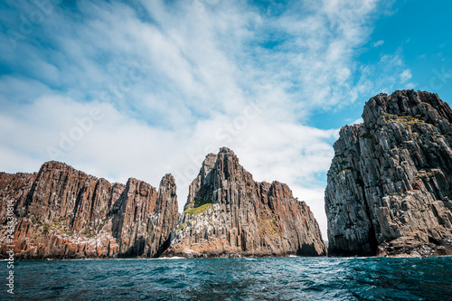 cliffs of the tasman peninsula on tasmania island, amazing coastline the highest rock cliffs in australia and the southern hemisphere , spectacular boat cruise on the rough atlantic ocean