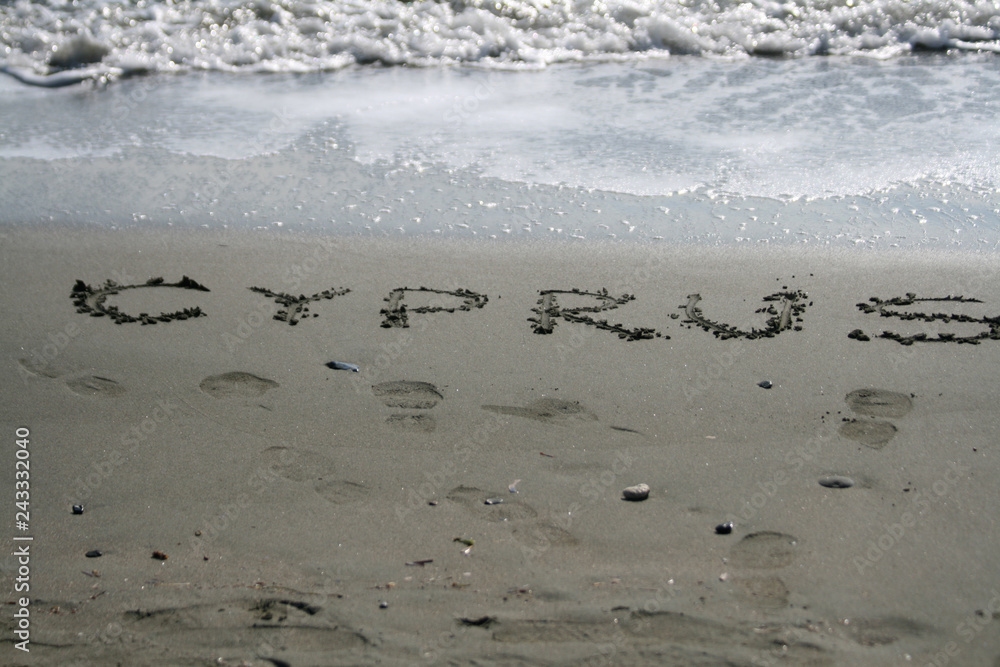 The word Cyprus written on the sand The word Cyprus written on the sand