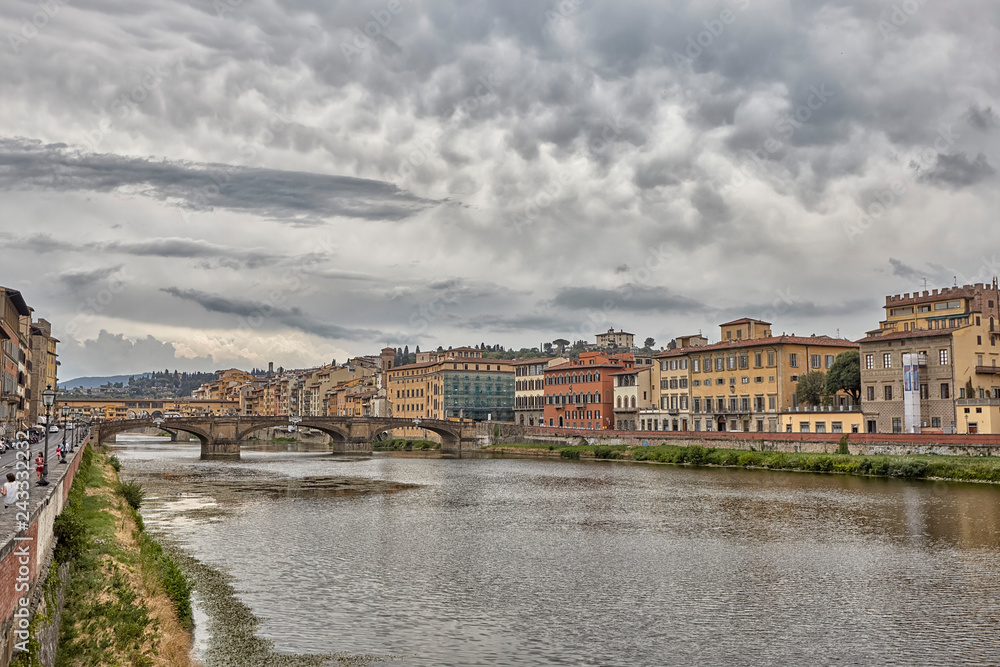 Florence or Firenze city view on Arno river, landscape with reflection. Tuscany, Italy.