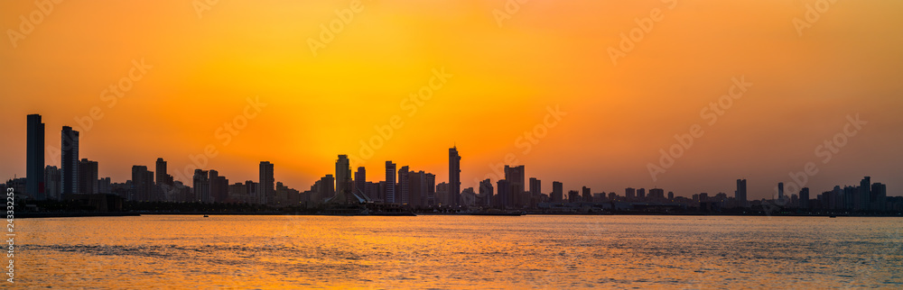 Skyline of Kuwait City at sunset. Skyline of Kuwait City at sunset.